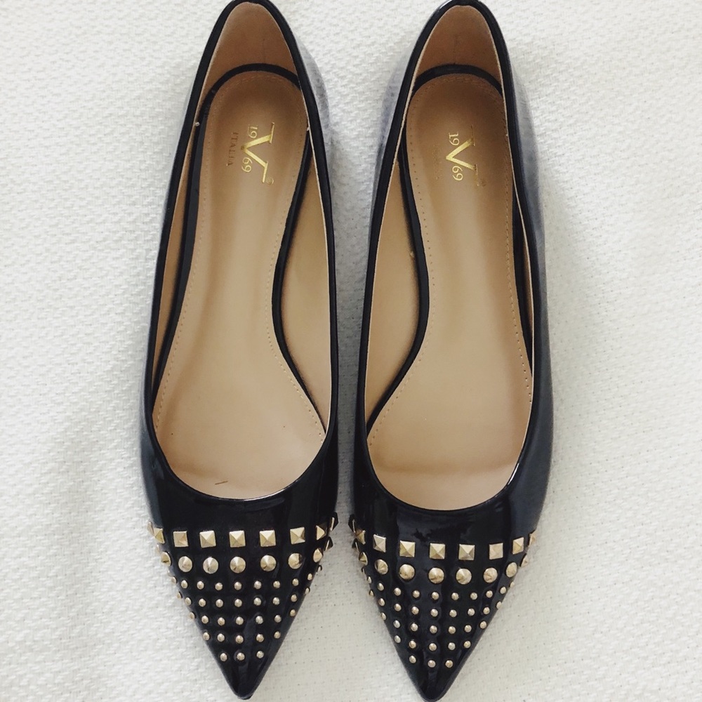 Black studded pointed flats.